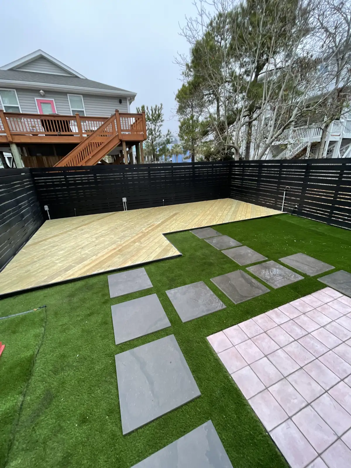 Custom composite deck with railing system in Wilmington NC backyard
