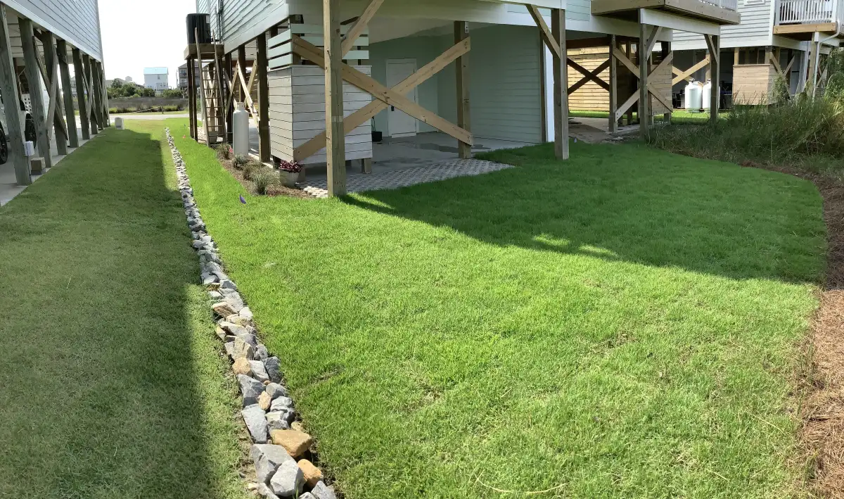 Natural stone pondless waterfall installation in Wilmington NC landscape