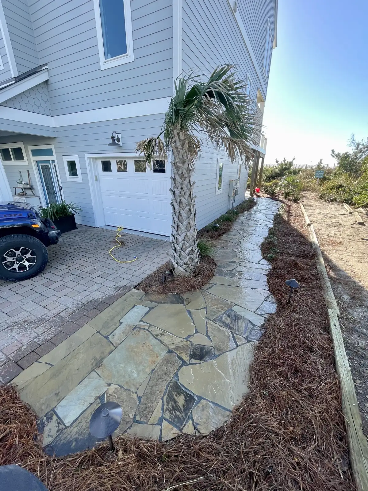 Custom stone masonry with natural stone veneer on outdoor kitchen in Wilmington NC