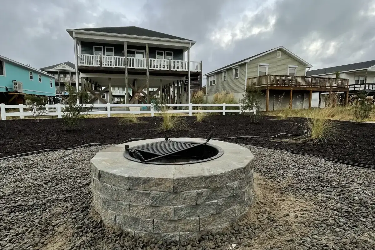 Complete outdoor living space with kitchen and fire feature in Wilmington NC