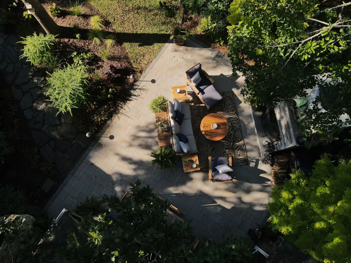 Luxury outdoor living space in Wilmington NC with paver patio and fire feature for coastal home
