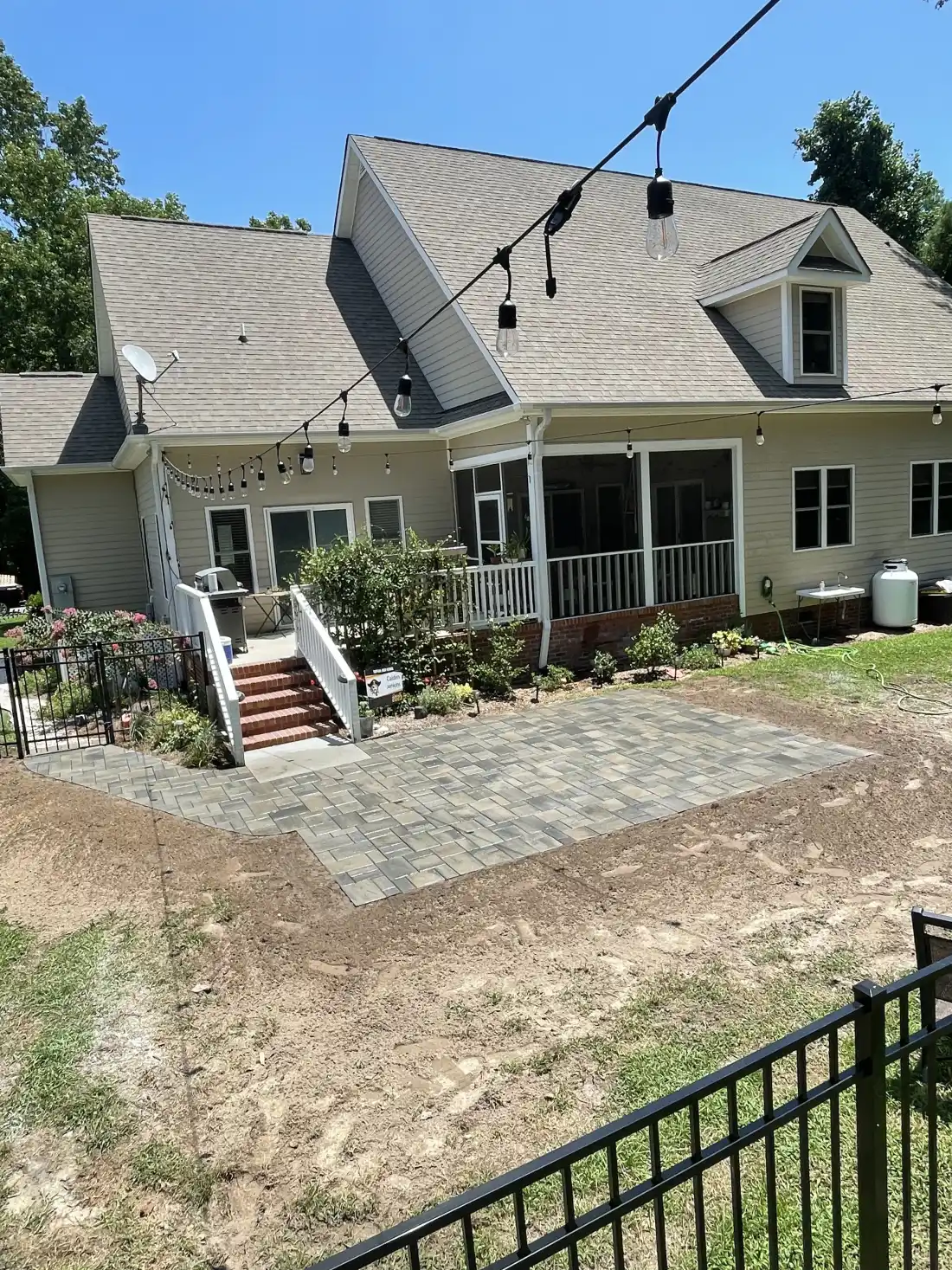 Luxury outdoor kitchen with dining zone and fire feature in Carolina Beach NC
